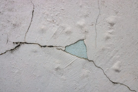 Stock Image: White Cracked Weathered Deteriorated Exterior Wall Texture