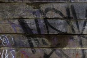 Stock Image: wooden planks smeared with graffiti