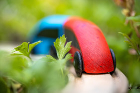 Stock Image: Wooden train on wooden rails in the garden