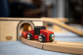 Stock Image: Wooden train with wooden tracks in the children's room