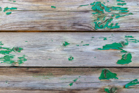 Stock Image: Wooden wall texture with peeling green colour