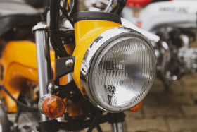 Stock Image: yellow motorcycle detail shot headlight