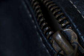 Stock Image: zipper black leather texture background