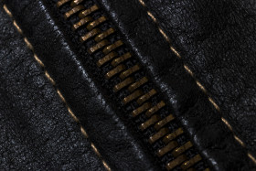 Stock Image: zipper black leather texture background