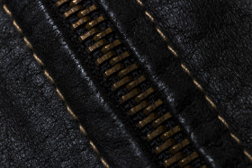Stock Image: zipper black leather texture background